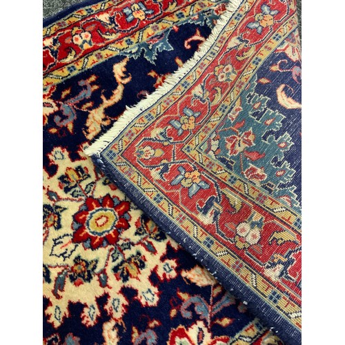 4 - A Fine Persian hand-made Sarough runner carpet, woven in shades of pale blue, red, and indigo, 423cm... 