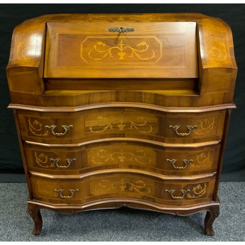 43 - A reproduction inlaid walnut french style writing desk bureau, shaped top with fall front over serpe... 