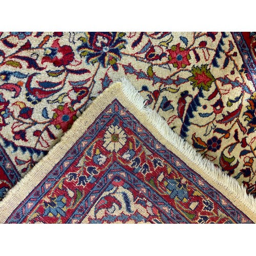 49 - A Fine Persian hand-made Brojerd runner carpet, woven in shades of red, mauve, and deep blue, on a c... 