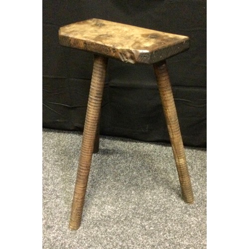 54 - A 19th century rustic stool, three turned legs, 62cm high