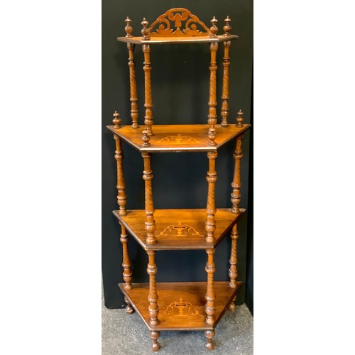 73 - A Victorian inlaid walnut four tier whatnot, arched pierced crest, four canted rectangular shelves, ... 