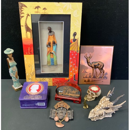 178 - An African picture, in relief with Zulu mother and children;  a cork diorama;  resin dragon trinket ... 