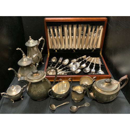 183 - A four  piece plated boat shaped tea service;  other teaware;   a Viners canteen of cutlery;  etc