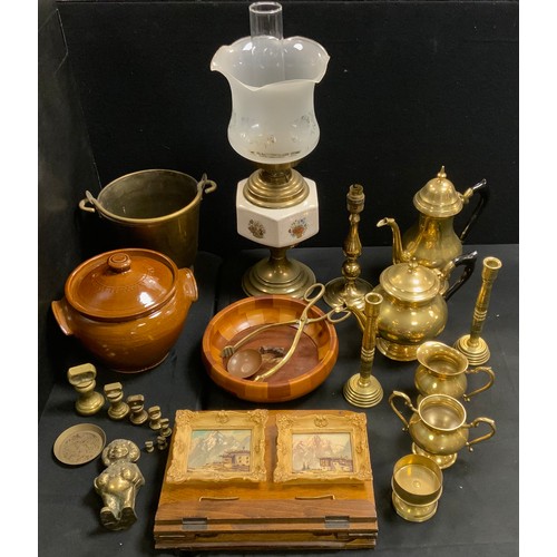 218 - A brass and ceramic oil lamp;  brass tea and coffee ware;  ice bucket;  oak music stand;  'Golly' mo... 