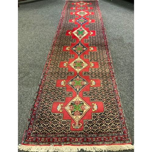 45A - A Fine Persian hand-made Senneh runner carpet, 382cm x 92cm.