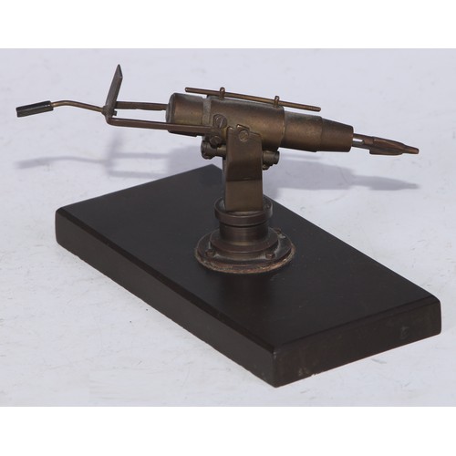 5253 - An early 20th century brass articulated  desk model, of a harpoon gun, rectangular base, 12.5cm wide