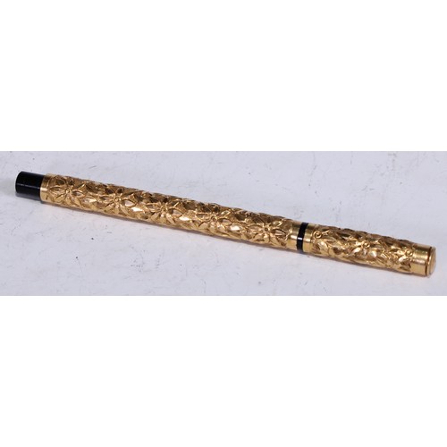 5380 - Pens - an early 20th century gold coloured metal mounted fountain pen, by Aikin Lambert & Co, profus... 