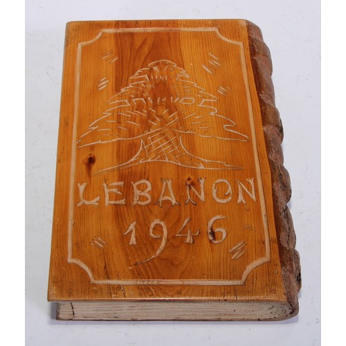 5142 - A Middle Eastern cedrus libani (cedar of Lebanon) novelty box, as a book, carved with a view of the ... 