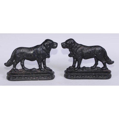 5164 - A pair of 19th century cast iron novelty door stops, each as a St Bernard dog, to left and right, 25... 