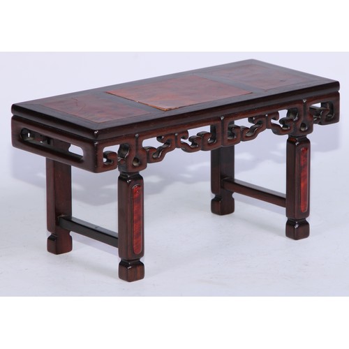 5073 - A Chinese burl and hardwood miniature altar table, panelled top above a deep frieze pierced and carv... 