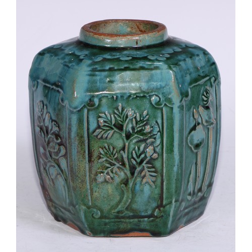 5076 - A Chinese monochrome hexagonal ginger jar, moulded in relief with prunus, bamboo and flowers, glazed... 