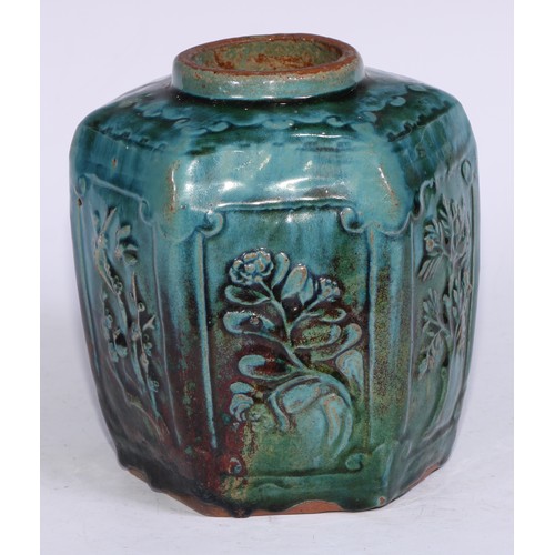 5076 - A Chinese monochrome hexagonal ginger jar, moulded in relief with prunus, bamboo and flowers, glazed... 