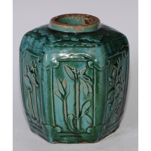 5076 - A Chinese monochrome hexagonal ginger jar, moulded in relief with prunus, bamboo and flowers, glazed... 