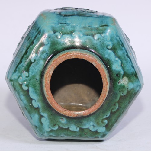 5076 - A Chinese monochrome hexagonal ginger jar, moulded in relief with prunus, bamboo and flowers, glazed... 