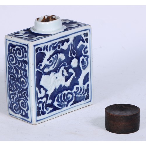 5079 - A Chinese porcelain rectangular tea caddy, moulded and painted in tones of underglaze blue with styl... 