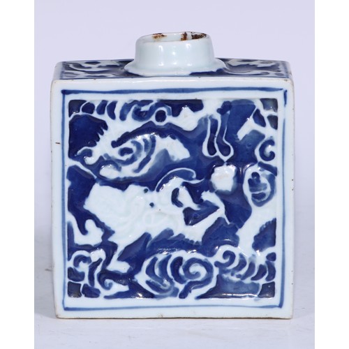 5079 - A Chinese porcelain rectangular tea caddy, moulded and painted in tones of underglaze blue with styl... 