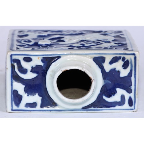 5079 - A Chinese porcelain rectangular tea caddy, moulded and painted in tones of underglaze blue with styl... 