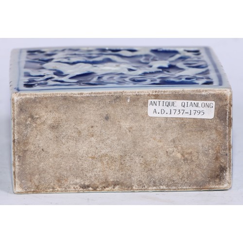 5079 - A Chinese porcelain rectangular tea caddy, moulded and painted in tones of underglaze blue with styl... 