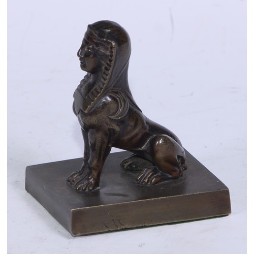 5323 - French School (19th century), a brown patinated desk bronze, of a sphinx, rectangular base, 9cm high