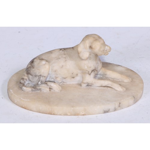 5324 - French School (19th century), an alabaster carving, of a recumbent dog, oval base, 12.5cm wide