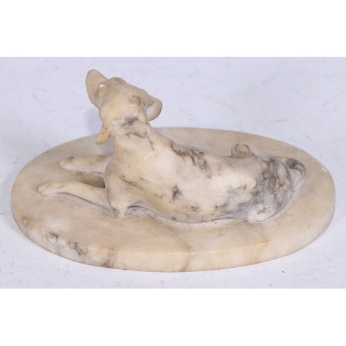 5324 - French School (19th century), an alabaster carving, of a recumbent dog, oval base, 12.5cm wide