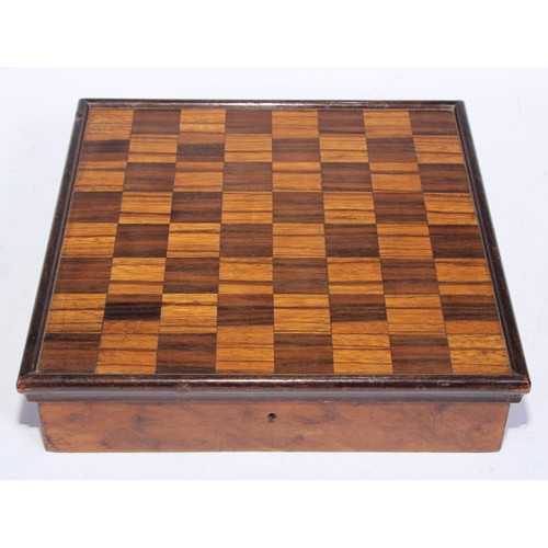 5245 - An Art Deco period walnut and parquetry games box, the hinged cover inlaid for chess, enclosing a fi... 