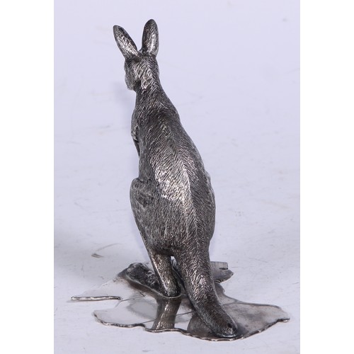 5249 - An Australian silver plated desk model, of a kangaroo, the base as a map of Australia, 9.5cm high, S... 