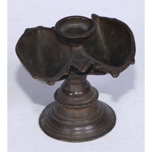 5269 - An Indian bronze lamp, lotus trumpet base, 8cm high, 19th century