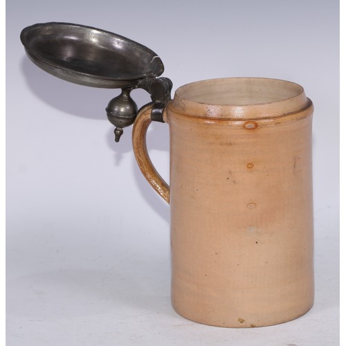 5238 - An 18th century pewter mounted English stoneware quart tankard, hinged cover with orb thumbpiece, 27... 