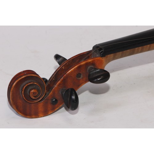 5224 - A violin, the two-piece back 36cm long excluding button, ebony tuning pegs, outlined throughout with... 