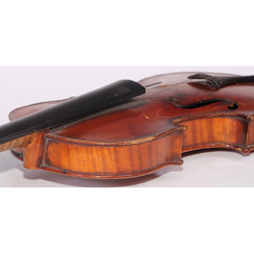 5224 - A violin, the two-piece back 36cm long excluding button, ebony tuning pegs, outlined throughout with... 