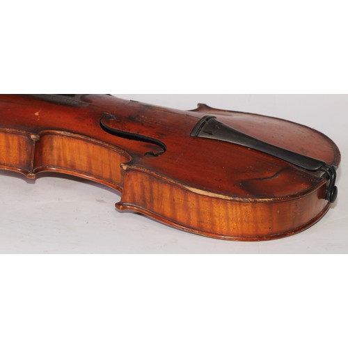 5224 - A violin, the two-piece back 36cm long excluding button, ebony tuning pegs, outlined throughout with... 