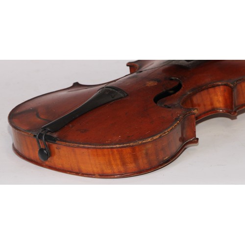 5224 - A violin, the two-piece back 36cm long excluding button, ebony tuning pegs, outlined throughout with... 