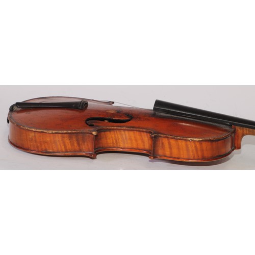 5224 - A violin, the two-piece back 36cm long excluding button, ebony tuning pegs, outlined throughout with... 