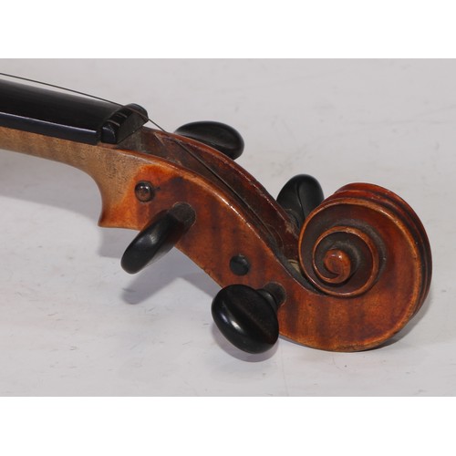 5224 - A violin, the two-piece back 36cm long excluding button, ebony tuning pegs, outlined throughout with... 