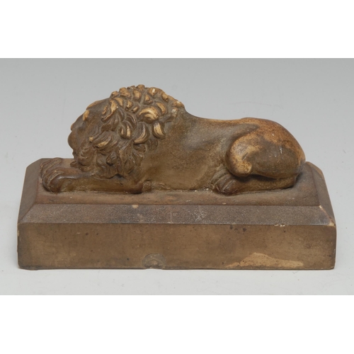 5113 - A Grand Tour plaster model, Sleeping Lion, after Antonio Canova, 13cm long, 19th century