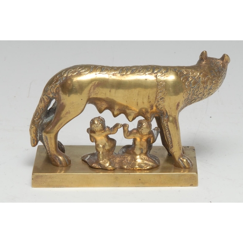 5257 - An early 20th century gilt brass desk model, The Capitoline Wolf, she stands, suckling Romulus and R... 