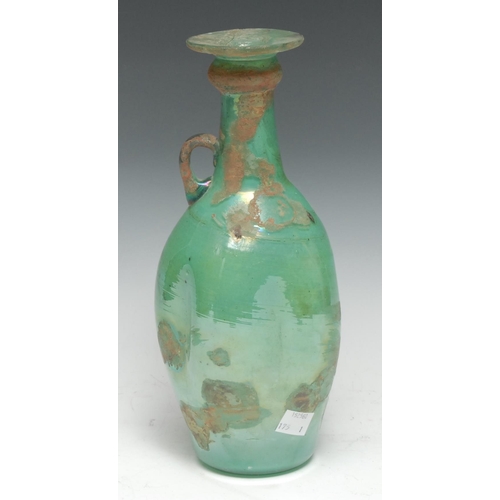 5284 - Antiquities - a glass amphora, loop handle, pontil scar to base, 27cm high