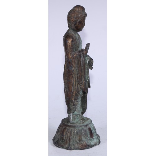 5291 - Chinese School (19th century), a cast figure, Bodhisattva, standing upon a lotus, verdigris surface,... 