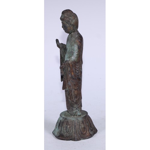 5291 - Chinese School (19th century), a cast figure, Bodhisattva, standing upon a lotus, verdigris surface,... 