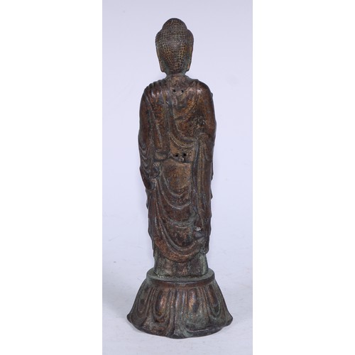 5291 - Chinese School (19th century), a cast figure, Bodhisattva, standing upon a lotus, verdigris surface,... 