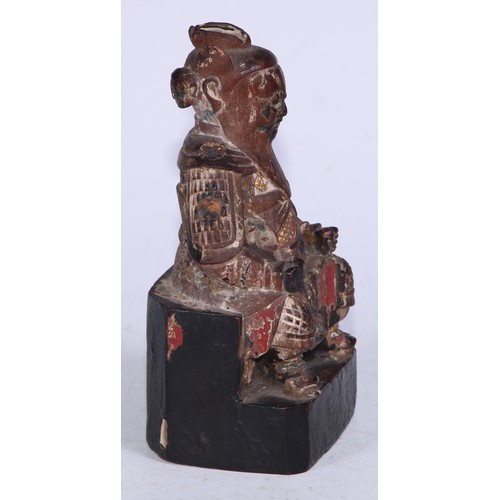 5077 - A Chinese polychrome carved figure, seated warrior, 14.5cm high