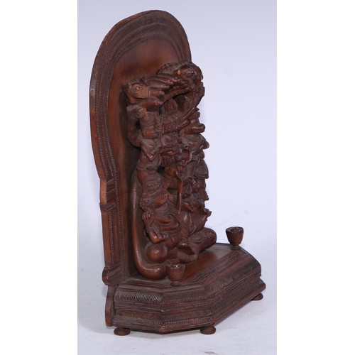 5278 - An Indian sandalwood votive shrine carving, arched back, 23cm high, 16cm wide, c.1900