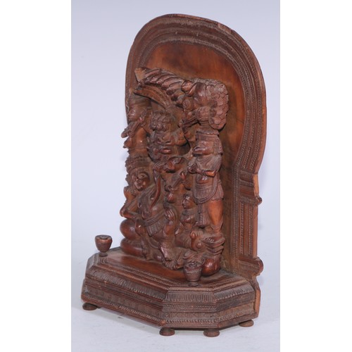 5278 - An Indian sandalwood votive shrine carving, arched back, 23cm high, 16cm wide, c.1900