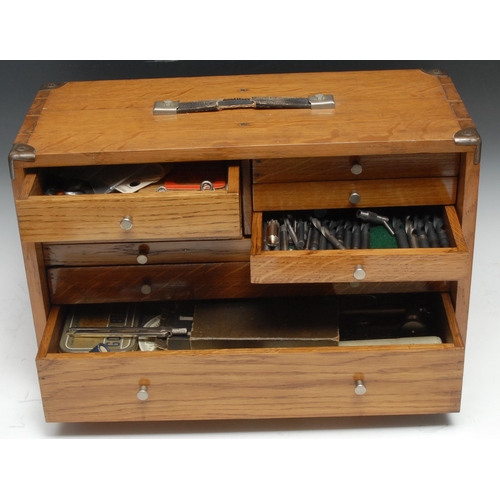 5265 - An early to mid- 20th century light oak engineer's cabinet, the removable fall front enclosing five ... 