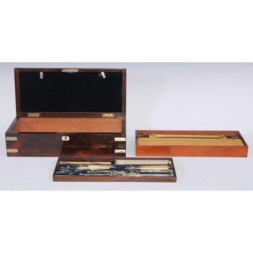 5128 - A large Victorian rosewood draughtsman's box, hinged cover enclosing a fitted interior with a compre... 