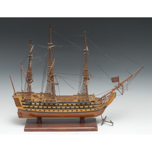 5356 - Maritime Interest - a softwood model of a three-masted ship of the line, 48cm long