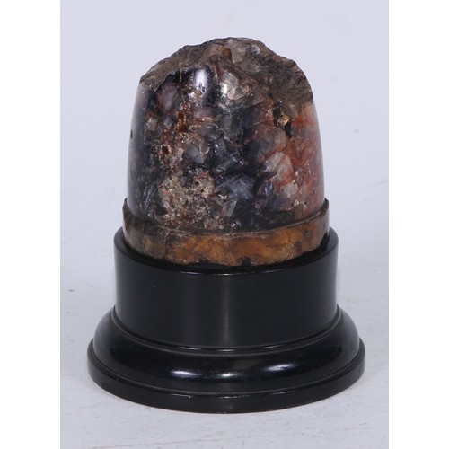 5097 - A Derbyshire Blue John section, mounted for display as a desk weight, ebonised plinth, 12cm high ove... 