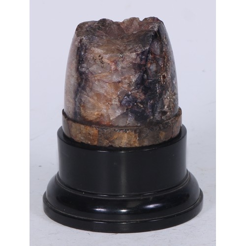 5097 - A Derbyshire Blue John section, mounted for display as a desk weight, ebonised plinth, 12cm high ove... 