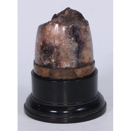 5097 - A Derbyshire Blue John section, mounted for display as a desk weight, ebonised plinth, 12cm high ove... 